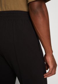 Weekday Kalhoty - black