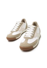 Beige and white sneakers with a combination of suede and smooth leather, featuring a rubber sole and white laces. Classic athletic design.