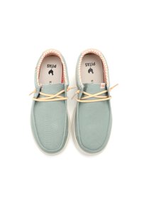 Light green canvas shoes with beige laces, a patterned interior lining, and a white rubber sole. Pitas logo printed on insoles.