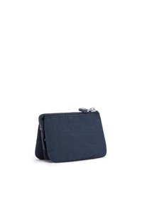 Mörkblå tygplånbok med zip-stängning, texturerad yta, kompakt design och förstärkt sömnad vid kanterna.