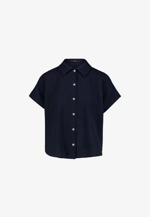 Marineblaue Bluse mit kurzen Ärmeln, strukturiertem Stoff, einem spitzen Kragen und einer Reihe weißer Knöpfe vorne.