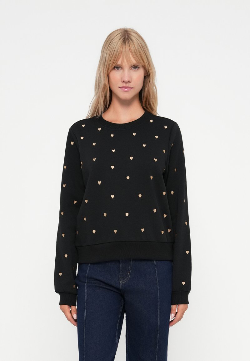 Sweat à capuche noir avec motif de cœurs dorés, col rond, manches longues et poignets côtelés. Tissu doux avec une coupe décontractée.