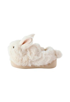 Soft beige slipper shaped like a fluffy bunny with ears, eyes, nose, and a small tail on a flat sole.