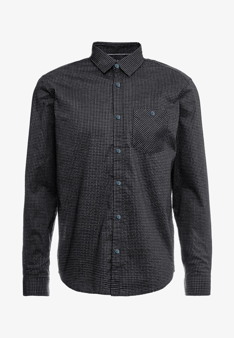 Chemise à manches longues à carreaux noirs et gris, avec col et une poche poitrine boutonnée.