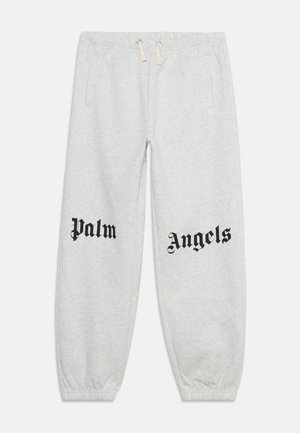 Hellgraue Jogginghose mit elastischem Bund und Bündchen, Kordelzugverschluss, Seitentaschen und schwarzem Text "Palm" am linken Bein und "Angels" am rechten Bein.