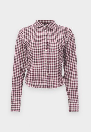 Long-sleeve button-up shirt in pink and purple checkered pattern. Features a collar, curved hem, and soft fabric texture.