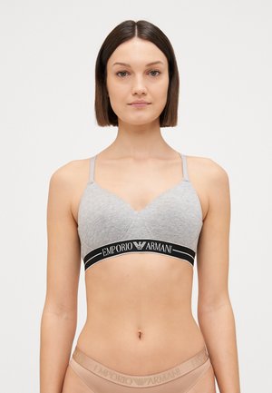 Sivi pamučni bralette s V-izrezom i tankim naramenicama. Ima crni pojas s logotipom "Emporio Armani". Jednostavan dizajn, udoban kroj.