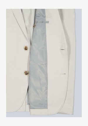 Beiger Blazer mit zwei braunen Knöpfen, der hellblaue Innenfutter und genähte Knopflöcher auf der rechten Seite zeigt.