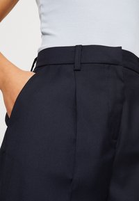 Vero Moda Kalhoty - dark blue