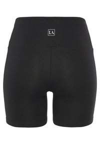 Svarta stretchshorts med hög midja, med en liten logga baktill och sömlösa sidor för en slät finish.