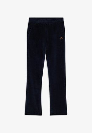 Pantalones de terciopelo azul marino con un diseño de pierna recta, dos bolsillos laterales y un pequeño emblema dorado en la cintura delantera. Textura suave.