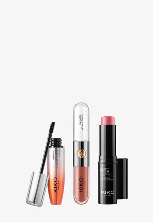 Drei KIKO Milano Kosmetikprodukte: eine schwarze Mascara mit silberner Kappe, ein transparenter Lippenprodukt mit goldenem Akzent und ein rosa Creme-Stick.