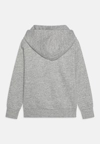 Gray hoodie made of soft, textured fabric. Features a large hood and ribbed cuffs. Minimalist design with no visible logos or patterns.