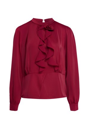Long-sleeve satin burgundy blouse with ruffled front and small fabric flower near collar, high neck, and buttoned cuffs.