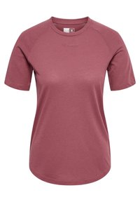 Kortärmad t-shirt med rund hals i en dämpad rosafärg. Tillverkad av texturerat tyg med en subtil logotyp på framsidan. Har raglanärmar.