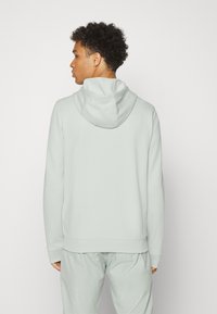 HUGO DARATSCHI - Sweatshirt com capuz - light pastel green