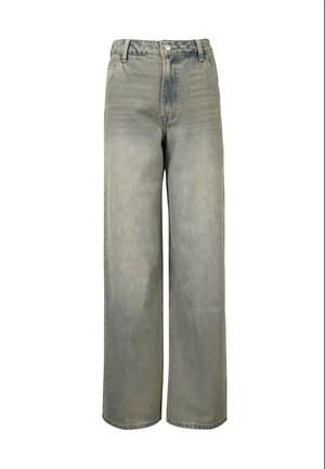 Laiad sinised denim püksid, millel on pleekinud tekstuur, kõrge vöökoht ja viie tasku disain. Omab metallist nööpi ja tõmblukuga sulgemist.