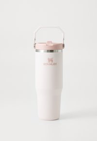 Stainless steel travel mug with a white matte finish and pink lid. Features a sturdy handle and logo engraving near the base.