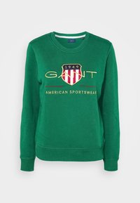Groene sweatshirt met een ronde hals, geribde manchetten en een centraal geborduurd logo met strepen en tekst, gemaakt van zachte katoen.