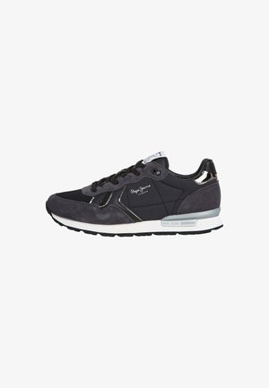 Black and grey sneakers featuring a mix of smooth and suede textures, lace-up design, metallic accents, and a cushioned white sole.