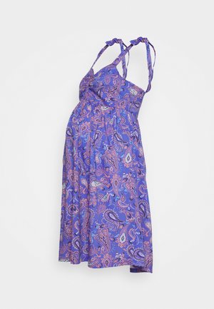 Vestido de maternidade roxo com padrão paisley, comprimento curto, alças ajustáveis com laço e tecido leve. Apresenta cintura franzida para conforto.