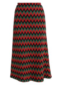 Knielanger Rock mit einem Zickzackmuster in Rot, Grün und Schwarz. Hergestellt aus strukturiertem Stoff mit einem elastischen Bund.