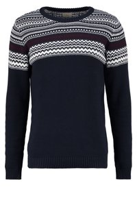 Marinblå stickad tröja med rund halsringning, prydd med ett vitt och vinrött geometriskt mönster över bröstet. Ribbad ärm- och fållkant.