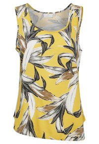 Blouse jaune sans manches avec grands motifs de feuilles tropicales blanches, noires et brunes, col rond et coupe ample.