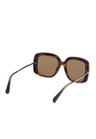 Oversized square sunglasses with brown gradient lenses and tortoiseshell frames and slim metal arms with black tips.