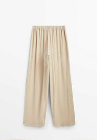 Beige vida byxa av sammet med elastisk midja, lös passform och raka fållar, visad mot en enkel vit bakgrund.