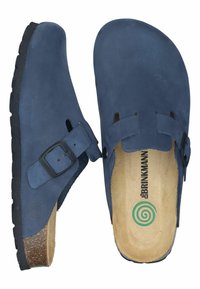 Navy blue clog shoes made from suede, featuring an adjustable buckle, open back, and cork footbed for comfort. Textured rubber sole.