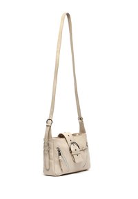 Beige faux leather crossbody bag with a long strap, two zippered front pockets, a buckle detail, and a smooth texture.