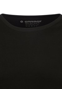 Zwarte crew-neck t-shirt gemaakt van 100% gekamd katoen. Heeft een ribbelstructuur en een semi-body fit, met een eenvoudig, schoon ontwerp.