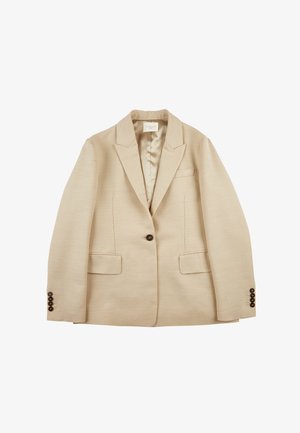 Blazer beige realizzato in tessuto testurizzato, con un bottone singolo, revers a punta, e due tasche frontali; dettagli con bottoni sulle maniche.