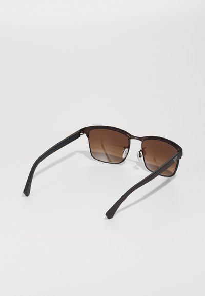 Brown sunglasses with a rectangular shape, black plastic frames, and gradient lenses. Includes adjustable nose pads and sleek temples.