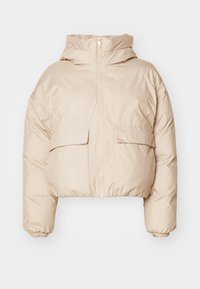Veste courte en doudoune crème fabriquée en tissu matelassé avec une fermeture éclair à l'avant, deux poches à rabat et des poignets élastiques. Conception avec capuche.