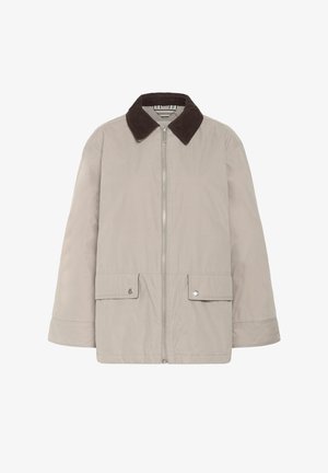 Beige színű, zipzáros dzseki sötétbarna kordbársony gallérral, két fedeles zsebbel, patentgombokkal, és hosszú ujjal.