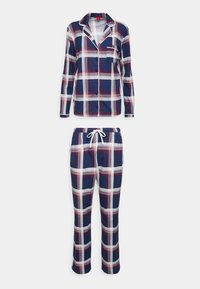 Marineblauw geruit pyjamastel met een langharige knoopsluiting en elastische taillebroek. Voorzien van witte piping en een borstzak. Zacht katoenmateriaal.