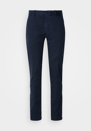 Donkerblauwe chinos gemaakt van een katoenmix. Voorzien van een knoopsluiting, riemlussen, recht gesneden ontwerp en een gladde textuur.