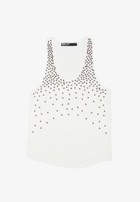 Tirante blanco con escote redondeado, adornado con tachuelas negras en un patrón degradado a lo largo del frente. Tejido suave.