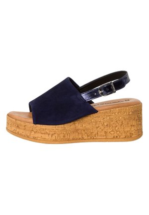 Navy suede wedge sandals with a cork platform, open toe design, and a patent leather ankle strap with a buckle closure.