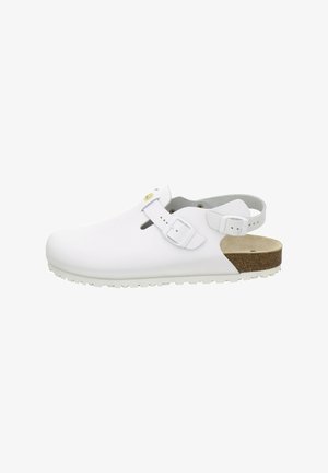 White closed-toe sandal with adjustable straps, cork footbed, and rubber sole designed for comfort and support.