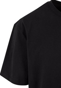 Black cotton t-shirt with a crew neck, short sleeves, and smooth texture. Features stitched hem and slight stretch in fabric.