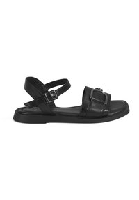 Black leather sandal with adjustable strap, square toe design, flat rubber sole, featuring a metallic buckle accent on the upper side.