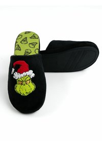 Black slippers with a plush texture, featuring a green Grinch graphic wearing a Santa hat. The insole is green with a Grinch pattern.