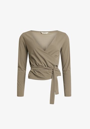 Šviesiai rudą ilgomis rankovėmis wrap stiliaus marškinėlį, pagamintą iš lygaus audinio. Sukurta giliu V formos iškirpimu ir liemens juosta, leidžiančia reguliuoti dydį.