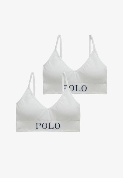 Bílá bavlněná souprava braletky s nastavitelnými ramínky, výstřihem do V a tmavě modrým logem "POLO" na pásku. Měkká textura, bezešvá konstrukce.