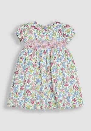 Lille lillelilledega kleit lühikeste puhvärvlitega, kortsus rind, ja kogutud seelik. Omab pastelltoone: roosa, kollane, sinine ja roheline muster. Puuvillane materjal.