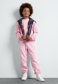 Champion EXCLUSIVE PANT UNISEX - Tréningruha alsók - pink