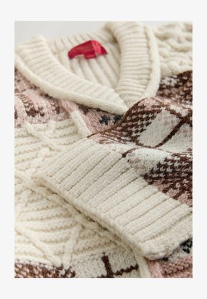 Knitted sweater in cream with a ribbed collar. Features geometric patterns in brown and blush, with a soft, textured finish.